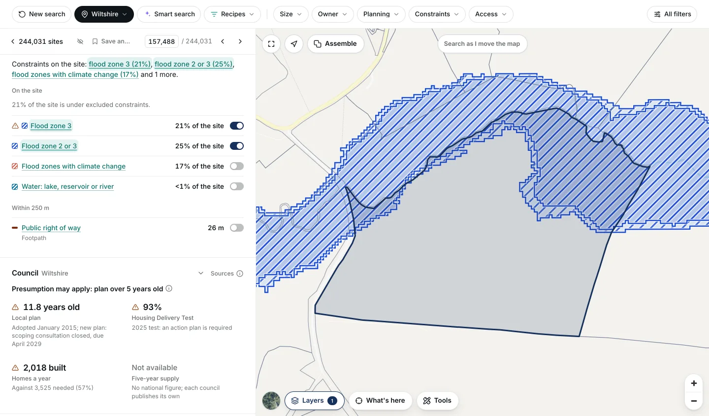 A field at Dilton Marsh, Wiltshire, with flood zone 3 on 21% of the site and flood zone 2 or 3 on 25% switched on: the flood zone is drawn hatched along the field's northern edge, beside the constraints list with each share.