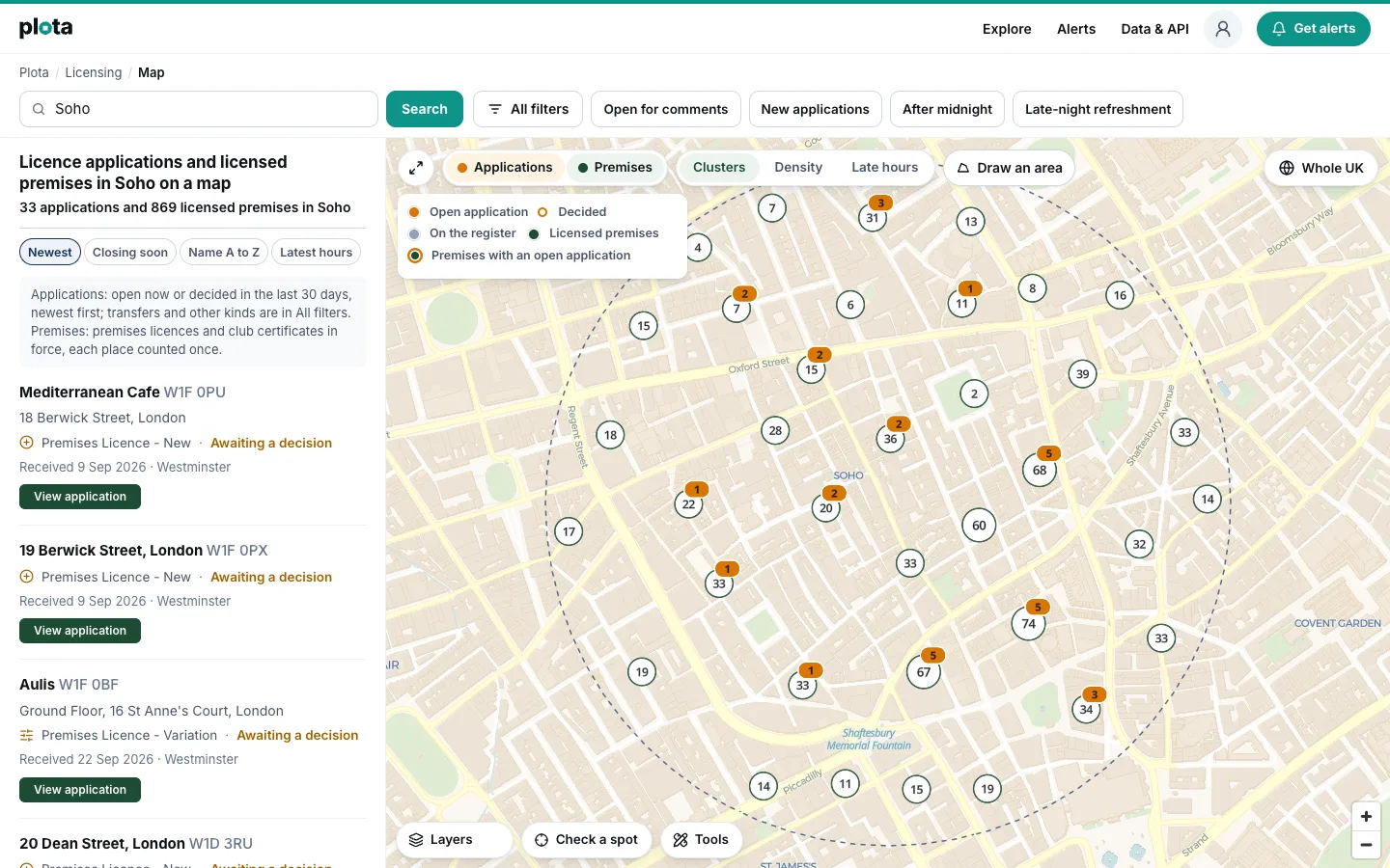 The licensing map searched for Soho: 33 applications and 869 licensed premises within 600 metres, with both switches on. The premises are grouped into numbered clusters, several carrying an amber count of their applications, and the list on the left is led by new premises licence applications on Berwick Street awaiting a decision.